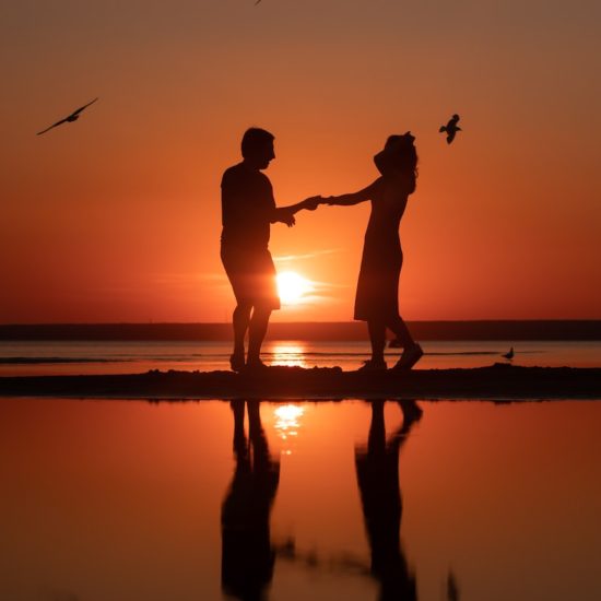 Silhouette of a Couple Dancing Together