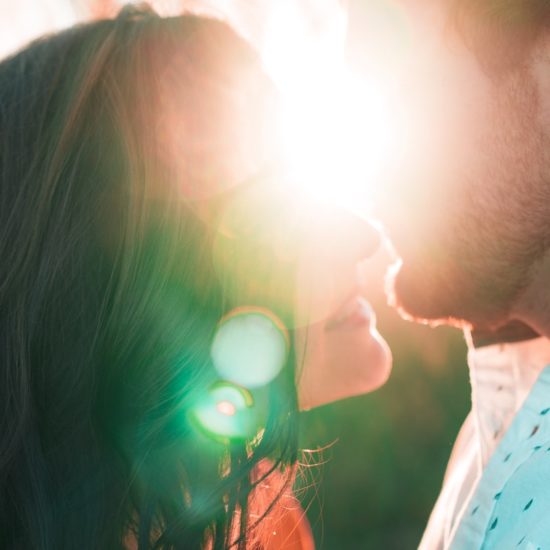couple kissing during golden hour